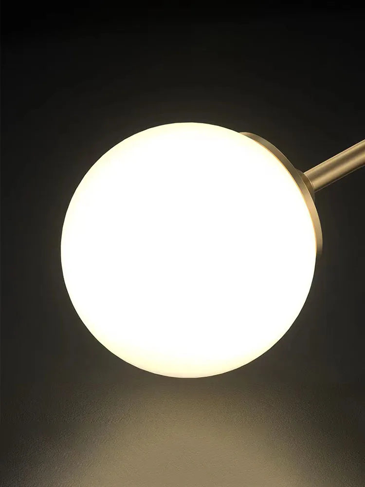 Lampe de table globe en verre doré