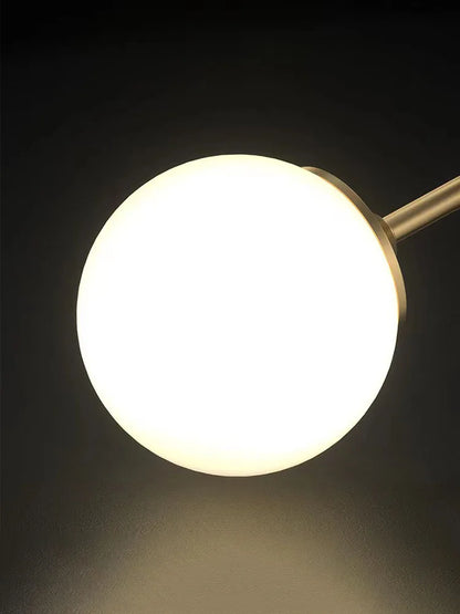 Lampe de table globe en verre doré