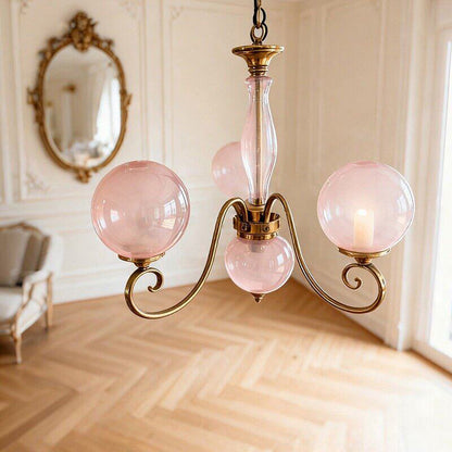 Lustre globe en laiton sculpté