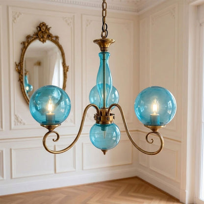 Lustre globe en laiton sculpté