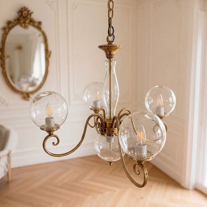 Lustre globe en laiton sculpté