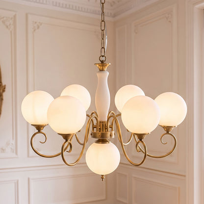 Lustre globe en laiton sculpté